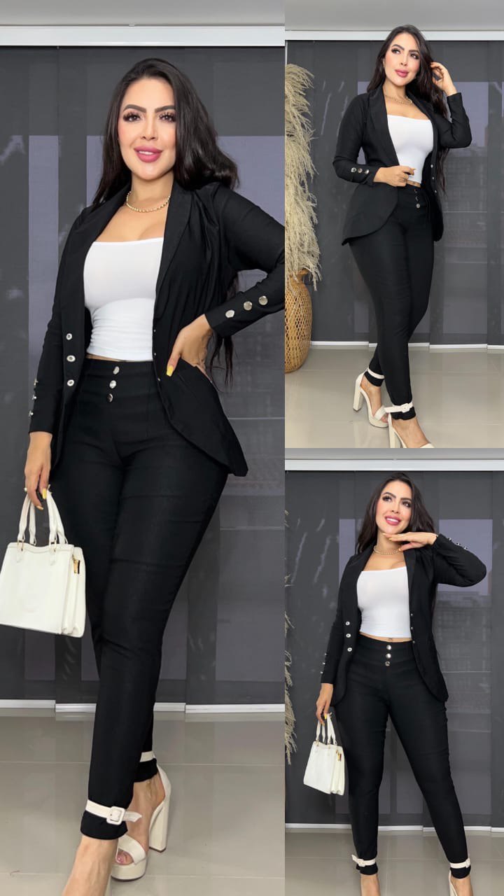 Conjunto de dama de tres piezas: blazer negro, pantalón negro y top blanco, estilo elegante.