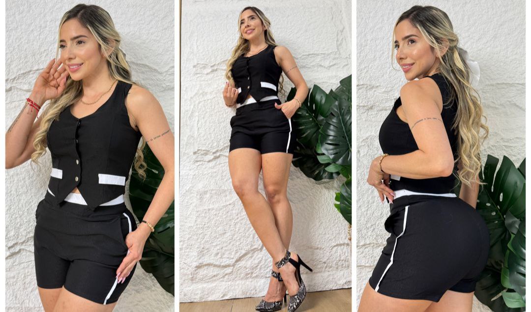 Mujer usando conjunto de short y chaleco negro con detalles blancos, ideal para verano